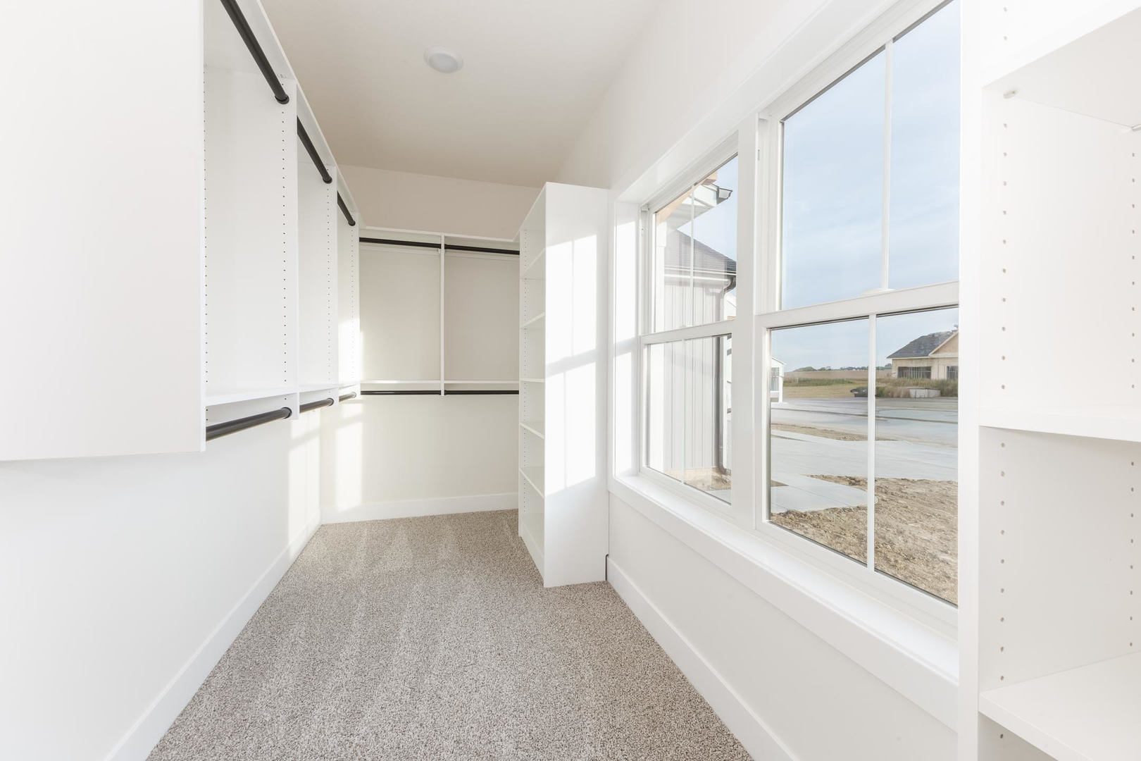 1009 Mount Carmel Road Bloomington, IL 61705 - Photo 23 of 39 a view of walk in closet with empty racks