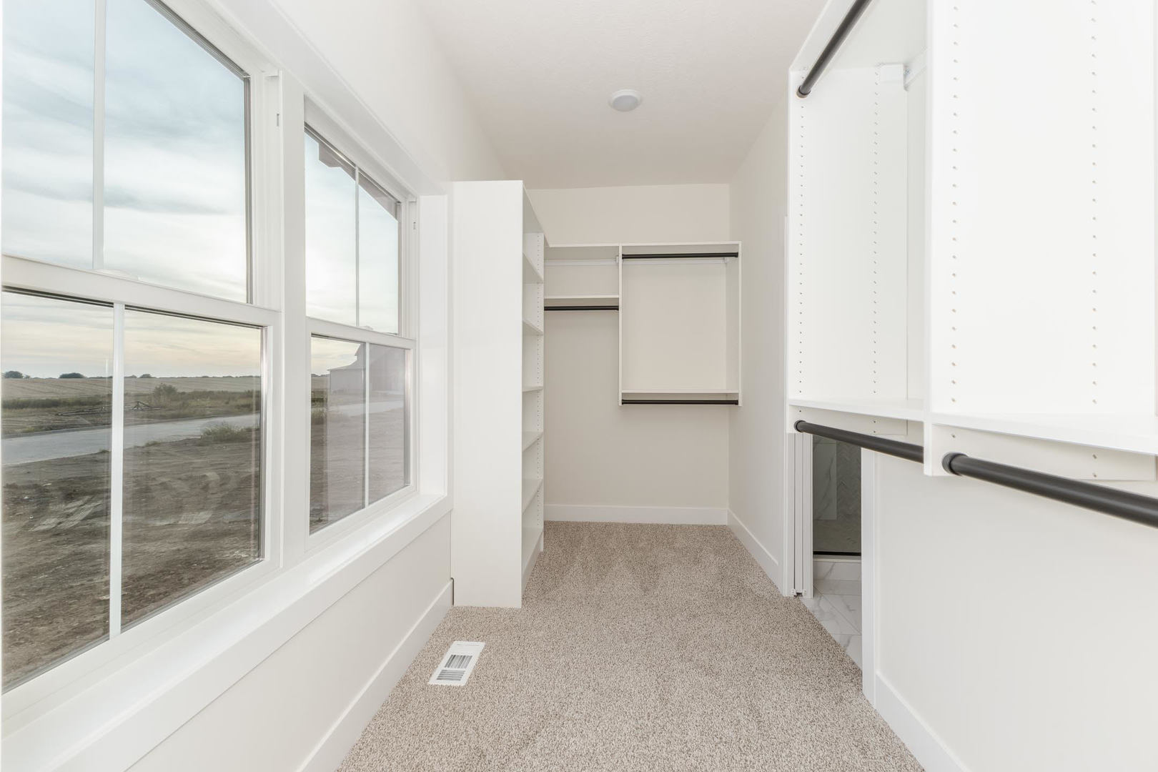 1009 Mount Carmel Road Bloomington, IL 61705 - Photo 24 of 39 a view of an empty room with a window