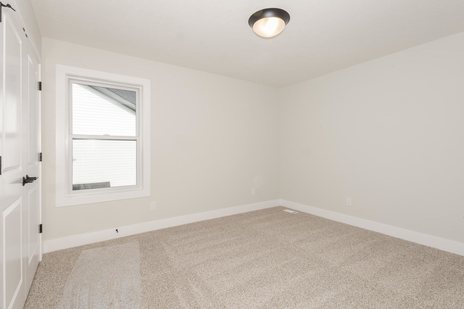 1009 Mount Carmel Road Bloomington, IL 61705 - Photo 29 of 39 an empty room with a window