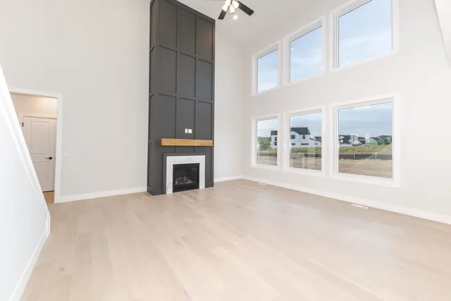 a view of an empty room with a fireplace