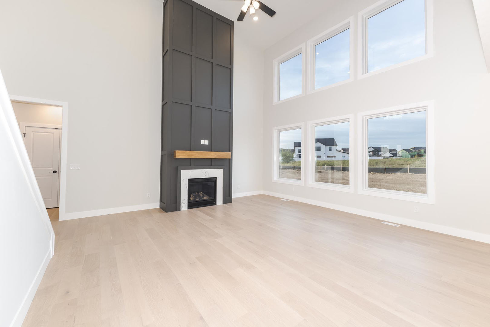 1009 Mount Carmel Road Bloomington, IL 61705 - Photo 3 of 39 a view of an empty room with a fireplace