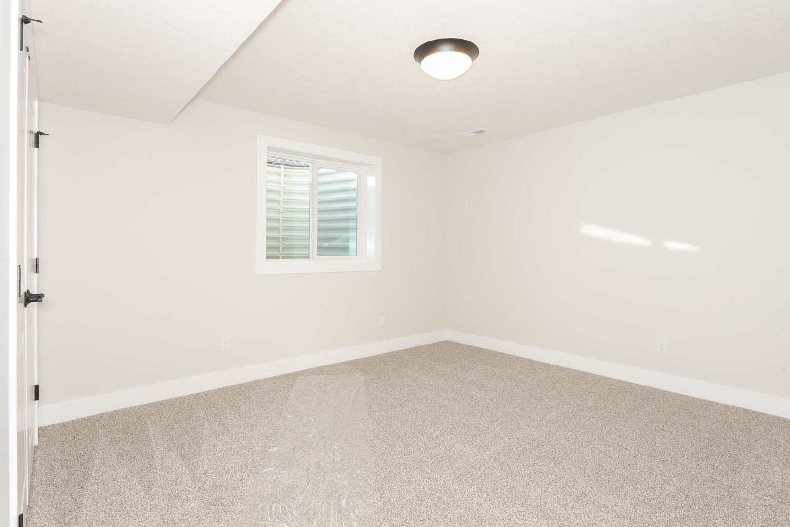 1009 Mount Carmel Road Bloomington, IL 61705 - Photo 34 of 39 an empty room with a window