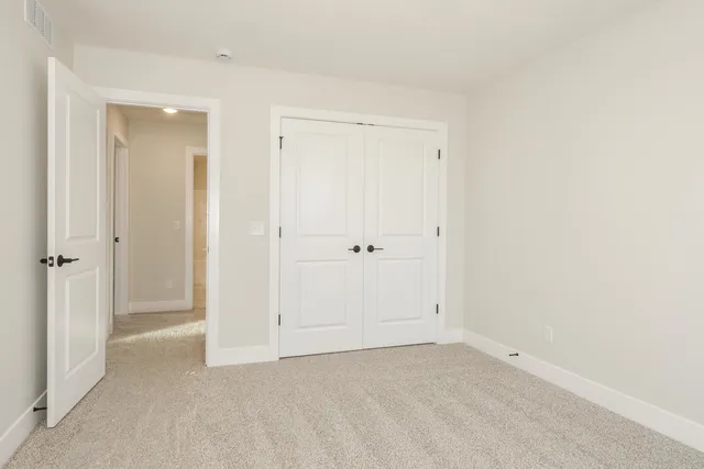 a spacious bathroom with a granite countertop sink a mirror and a vanity