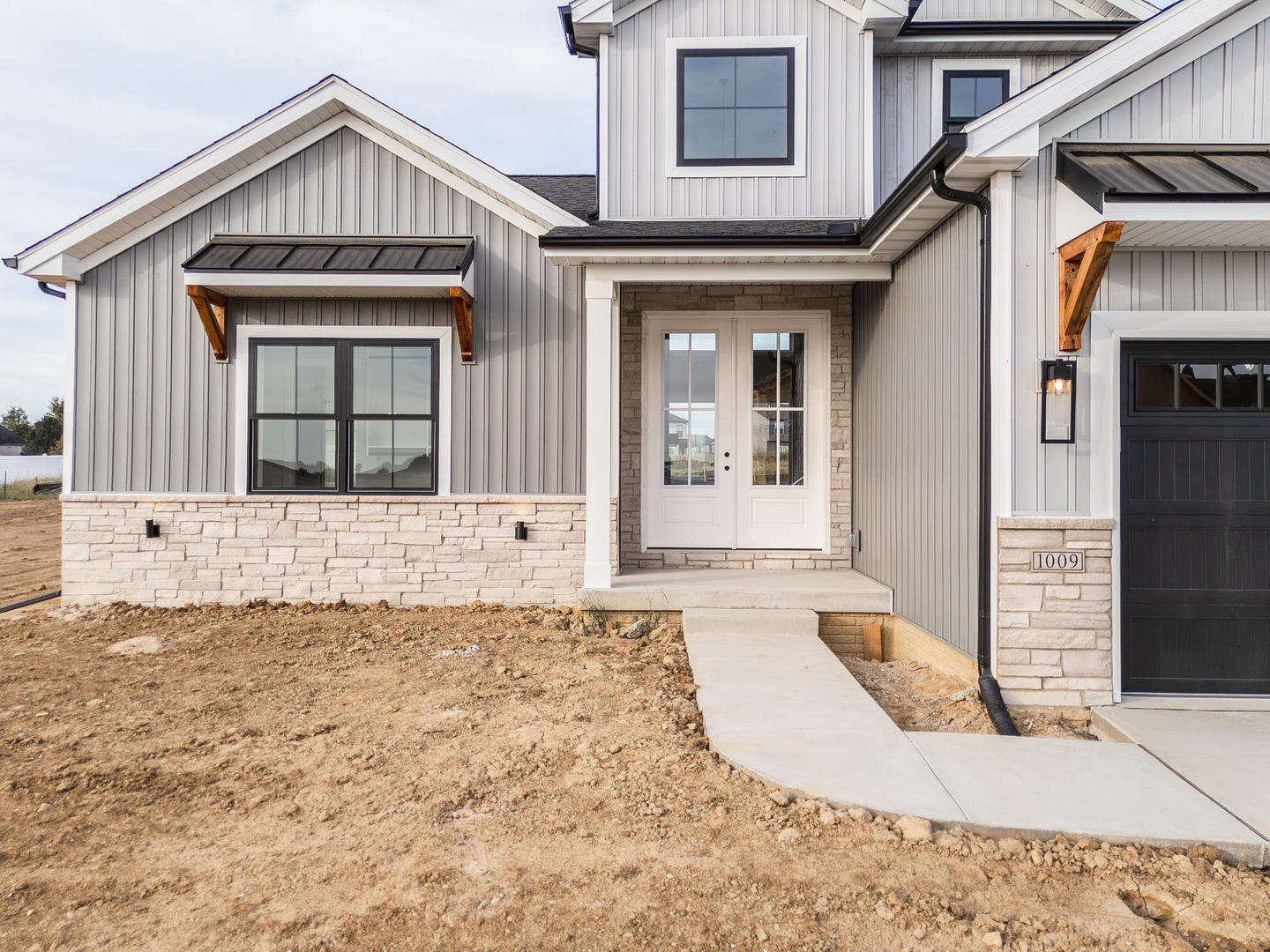 1009 Mount Carmel Road Bloomington, IL 61705 - Photo 39 of 39 a front view of a house with a yard