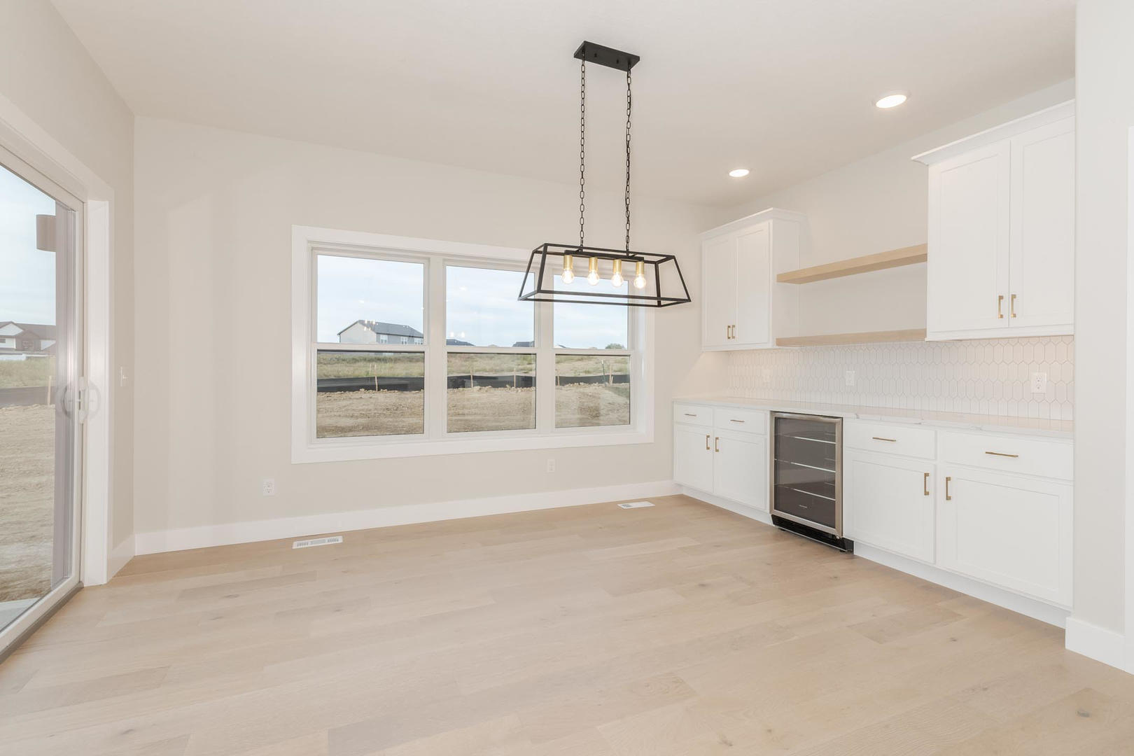 1009 Mount Carmel Road Bloomington, IL 61705 - Photo 6 of 39 a view of an empty room with a window
