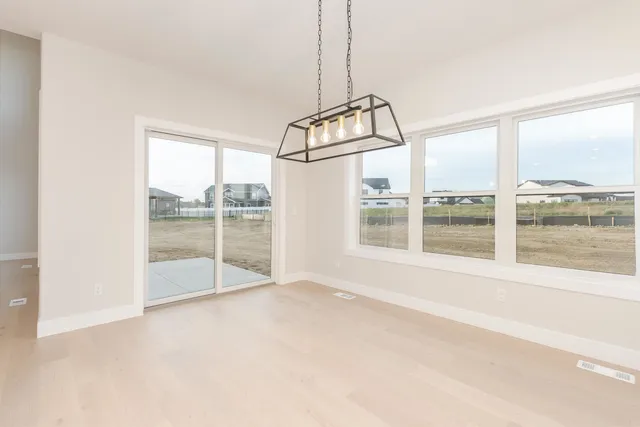 a view of a room with window wooden floor