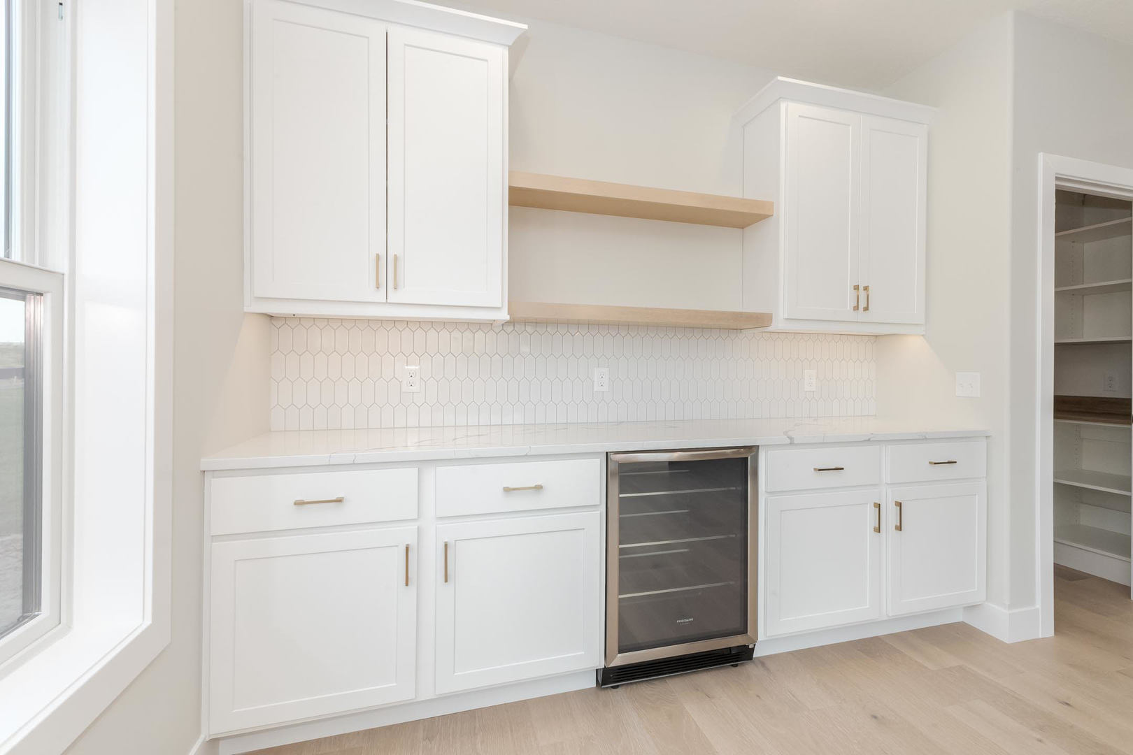 1009 Mount Carmel Road Bloomington, IL 61705 - Photo 8 of 39 an empty room with cabinets