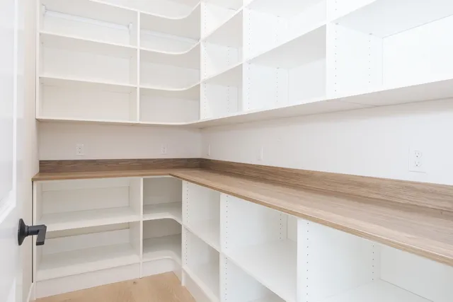 a view of an empty walk in closet