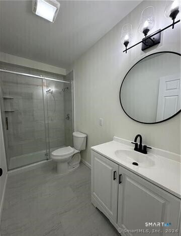 61 Colony Street, Unit 3C Meriden, CT 06451 - Photo 6 of 8 a bathroom with a sink a toilet and shower