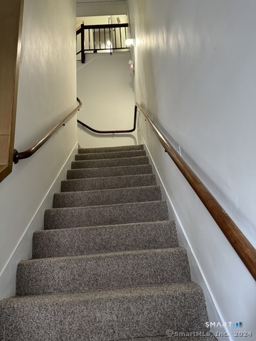 61 Colony Street, Unit 3C Meriden, CT 06451 - Photo 8 of 8 a view of staircase with lots of frames on wall