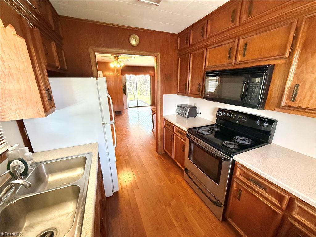 1643 Highway 770 Sandy Ridge, NC 27046 - Photo 8 of 36 Corian countertops and modern appliances.