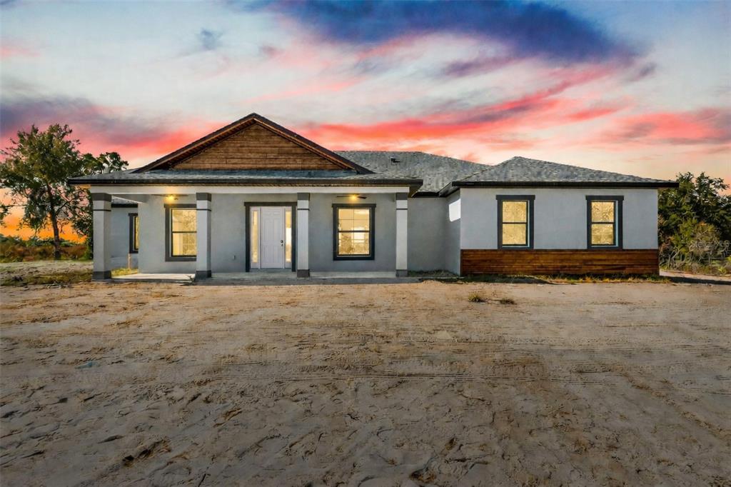 front view of a house with a yard