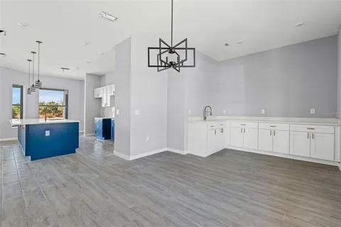 a view of a kitchen with wooden floor