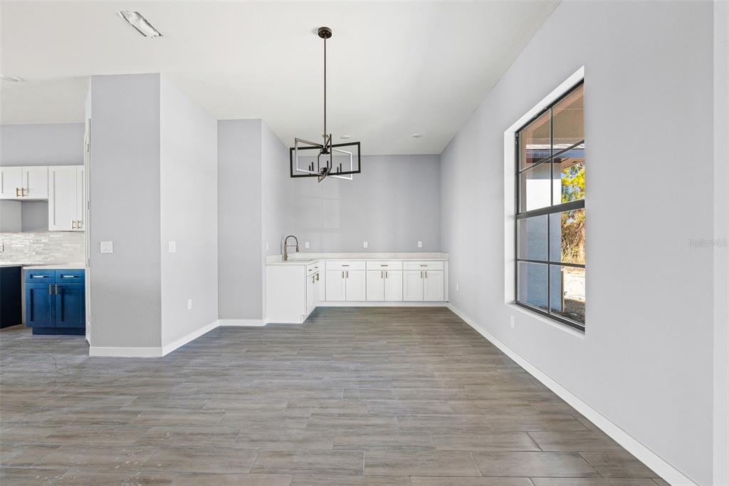 6137 Grove Boulevard Punta Gorda, FL 33982 - Photo 12 of 28 a view of an empty room with window and cabinet
