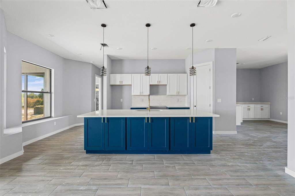 6137 Grove Boulevard Punta Gorda, FL 33982 - Photo 7 of 28 a view of kitchen and wooden floor