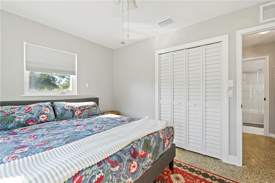 1621 5th Avenue Vero Beach, FL 32960 - Photo 14 of 35 a bedroom with a bed and a window