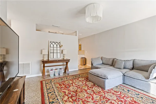 a living room with furniture and a couch