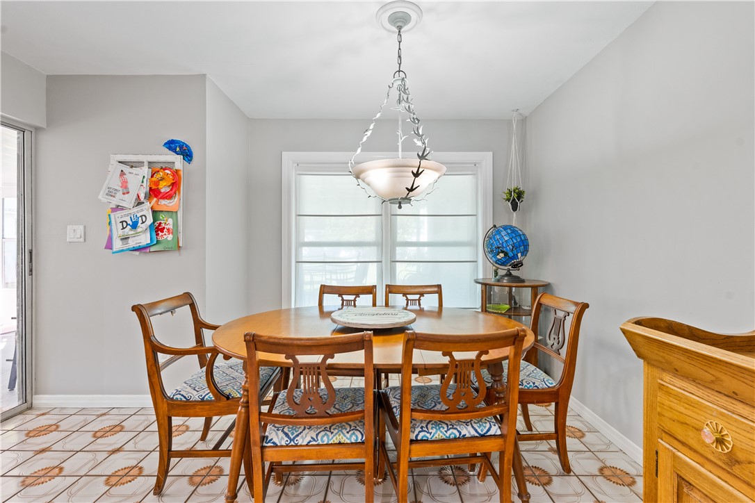 1621 5th Avenue Vero Beach, FL 32960 - Photo 10 of 35 a dining room with furniture and window