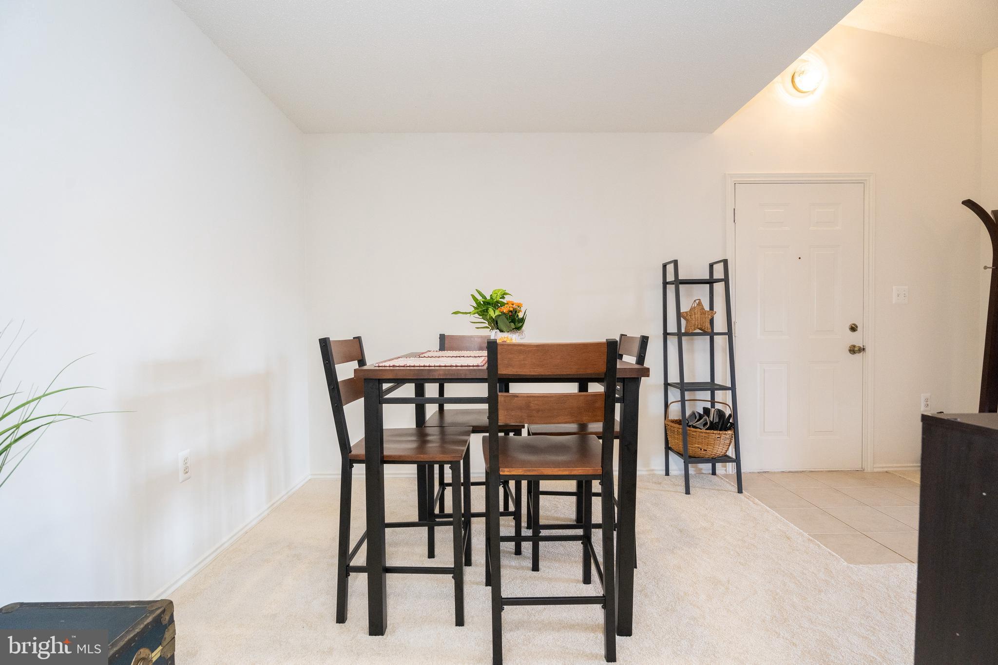 20963 Timber Ridge Terrace, Unit 301 Ashburn, VA 20147 - Photo 6 of 24 Entry opens to Dining Room