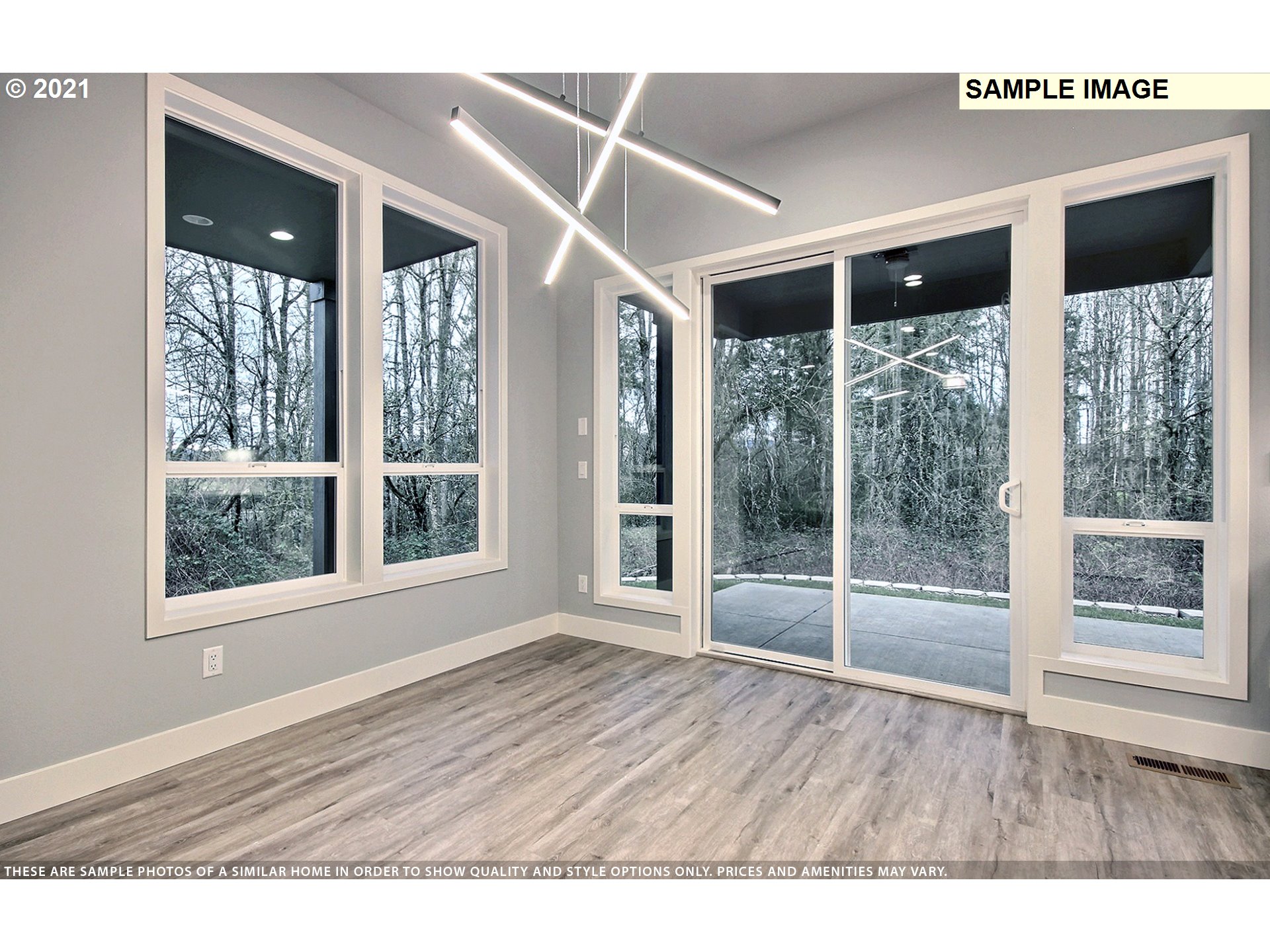 3338 Northwest Tanner Street Camas, WA 98607 - Photo 11 of 25 a view of an empty room with wooden floor and windows