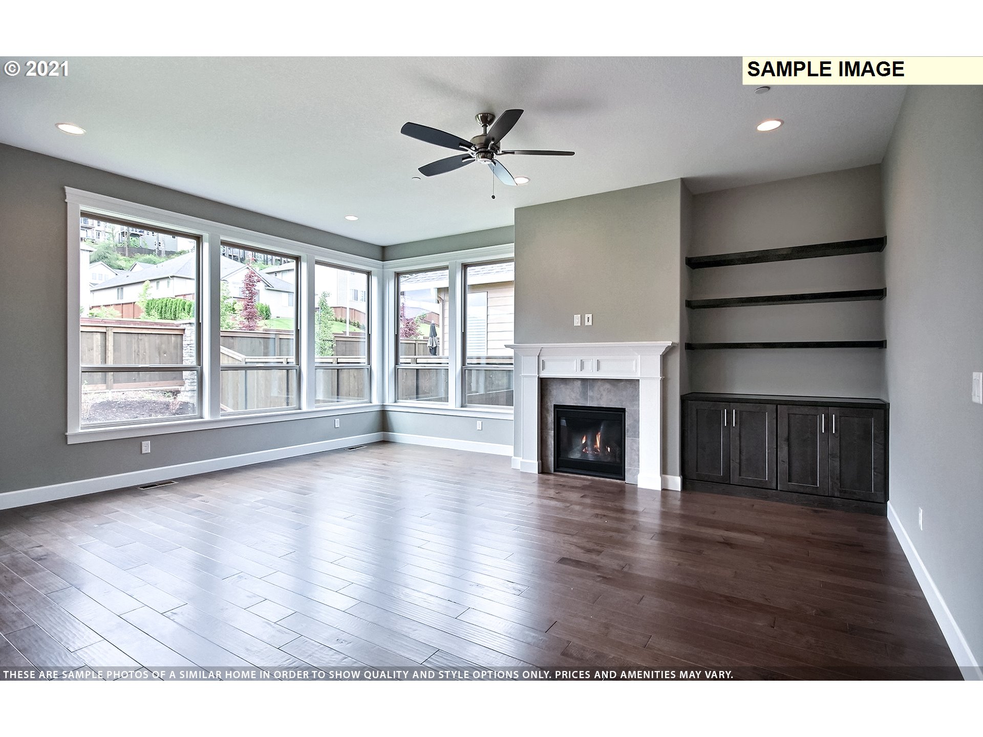 3338 Northwest Tanner Street Camas, WA 98607 - Photo 6 of 25 a view of empty room with wooden floor and fireplace