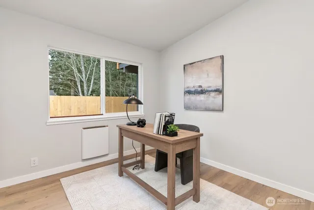 a room with a table and windows