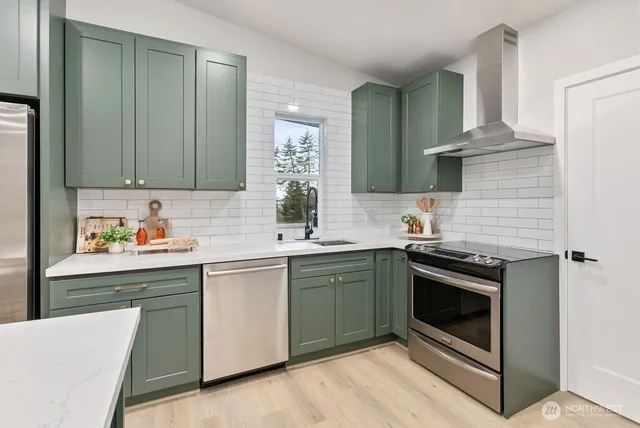 a kitchen with a sink stove and cabinets