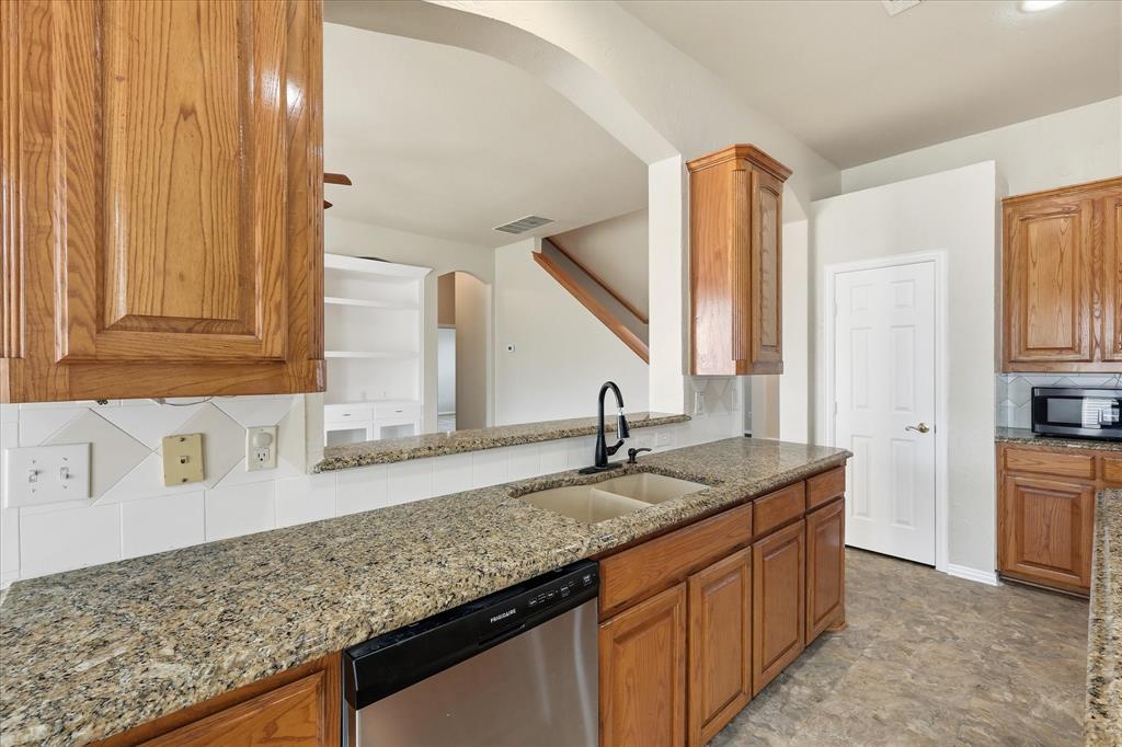 944 Hedgcoxe Road Plano, TX 75025 - Photo 15 of 40 Granite countertops, loads of cabinet space, and a center island - meal prep will be a breeze!