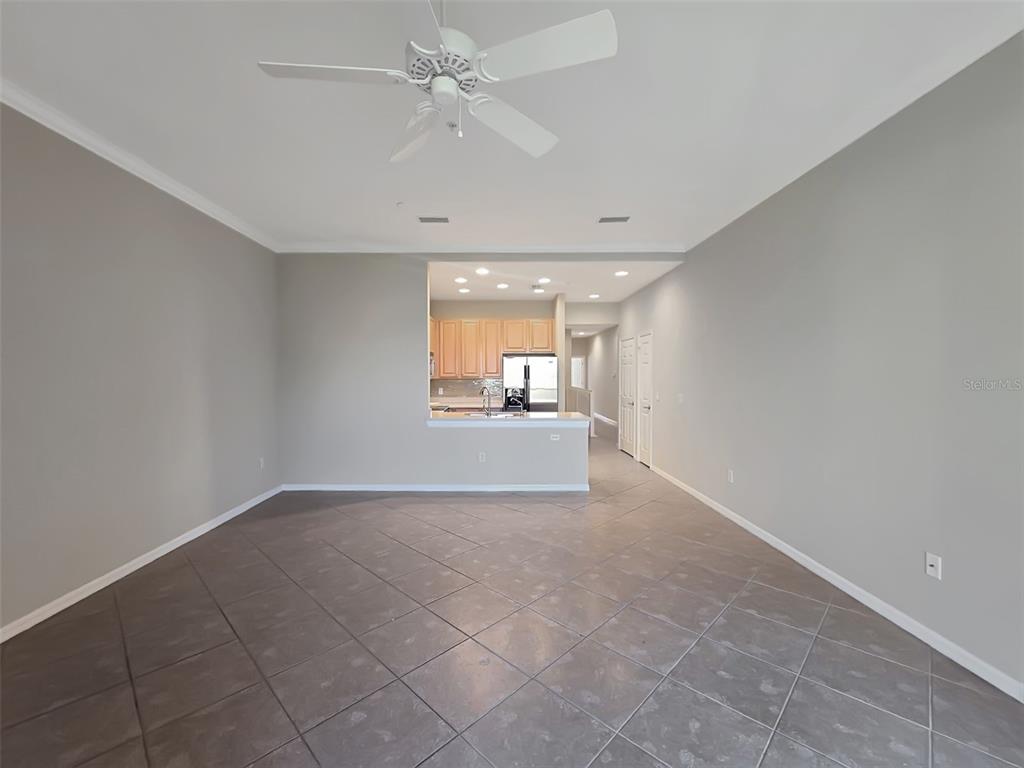 4203 Overture Circle Bradenton, FL 34209 - Photo 11 of 25 a view of a livingroom with a ceiling fan and window