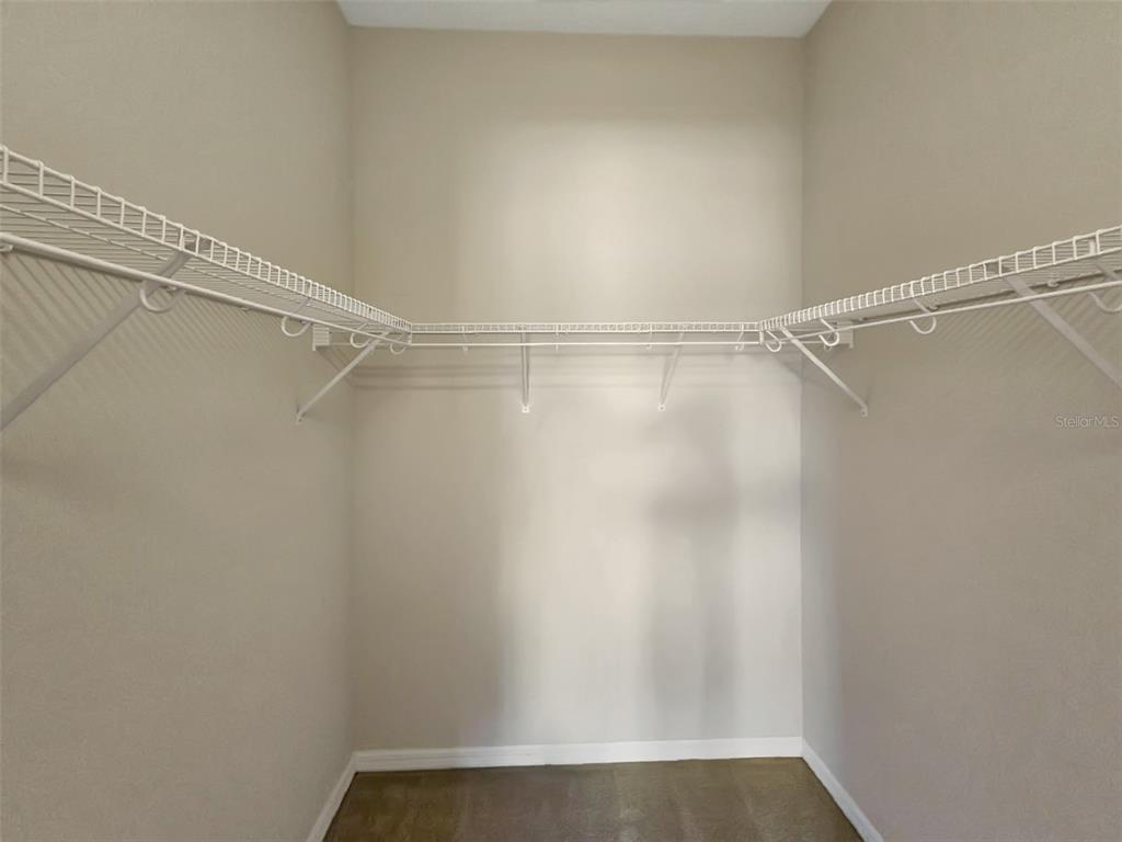 4203 Overture Circle Bradenton, FL 34209 - Photo 15 of 25 a view of a room with racks on the wall