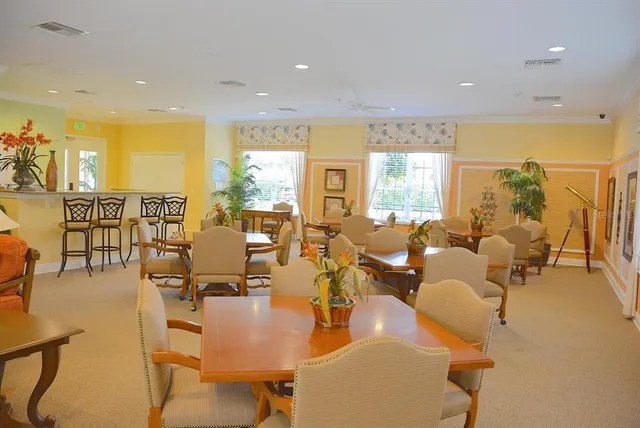 a living room with lots of furniture and a large window