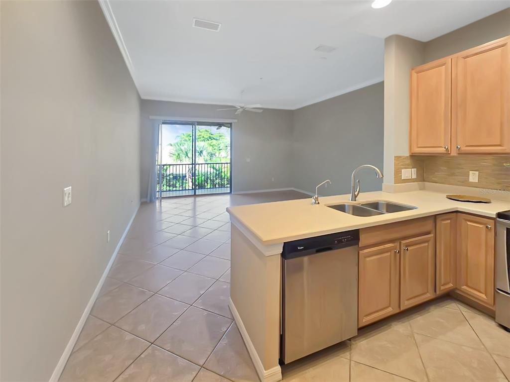4203 Overture Circle Bradenton, FL 34209 - Photo 4 of 25 a kitchen with a sink cabinets and window