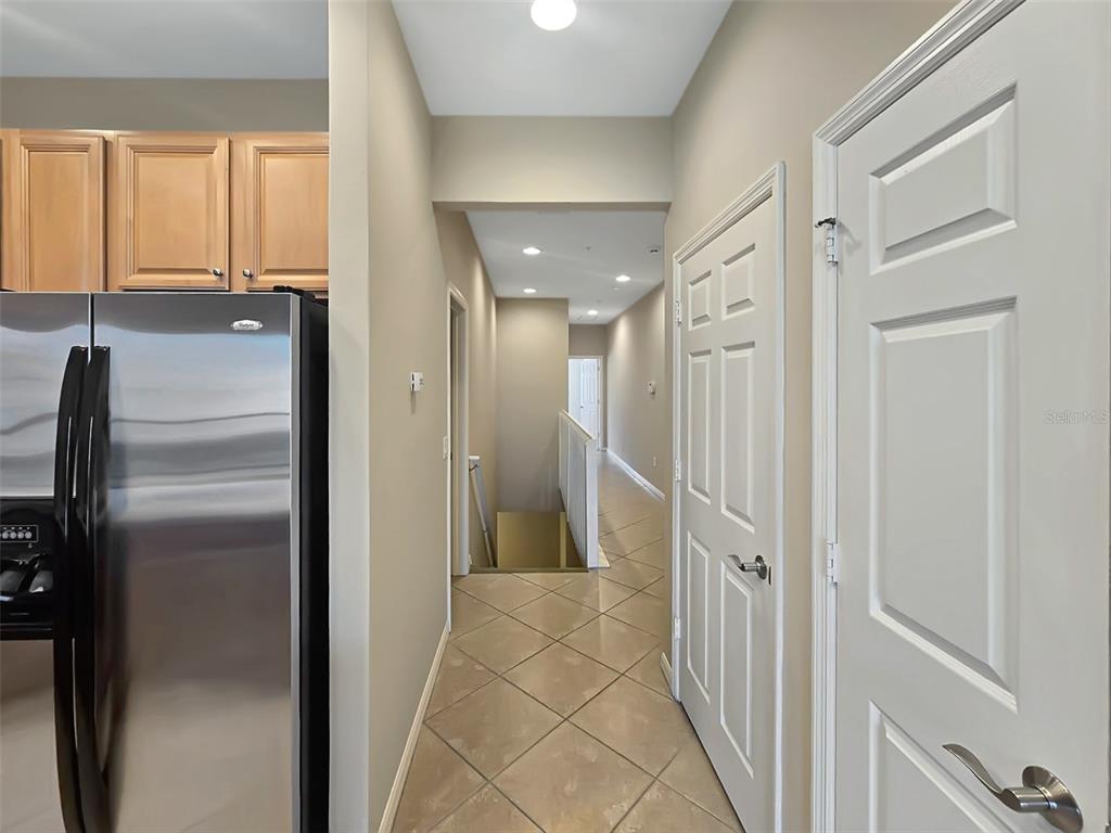 4203 Overture Circle Bradenton, FL 34209 - Photo 5 of 25 a view of a hallway with wooden cabinets