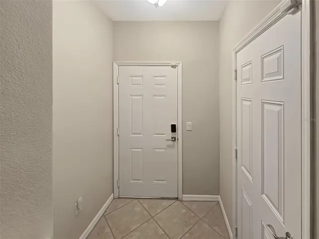 an empty room with closet area