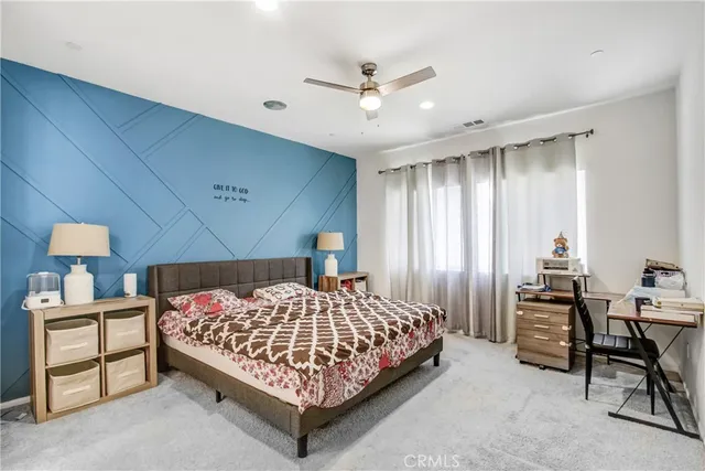 a bedroom with a bed and a furniture