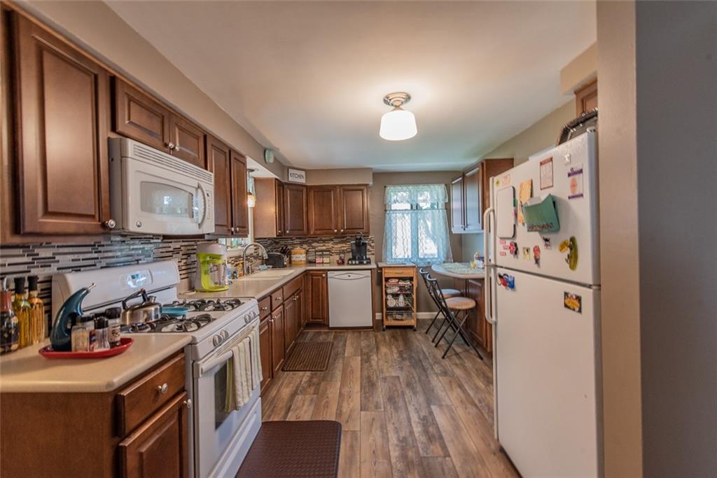 662 Meadow Road Irwin, PA 15642 - Photo 8 of 25 Updated kitchen with new laminate flooring!