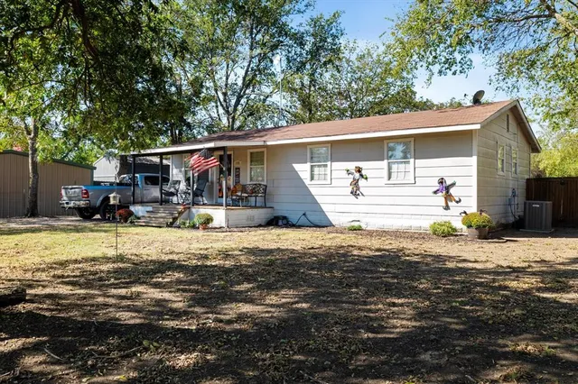 a front view of a house with a patio