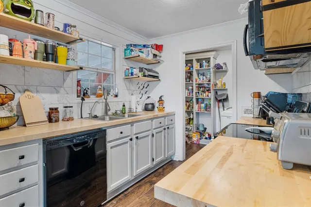 a open kitchen with stainless steel appliances granite countertop a sink and cabinets