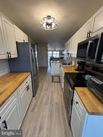 a kitchen with a table and chairs in it