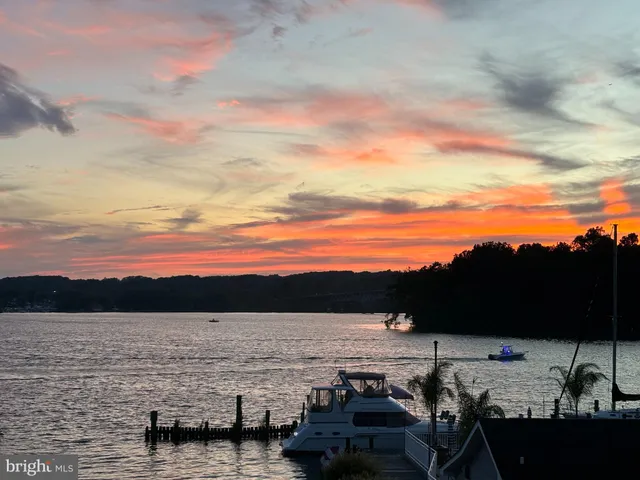 a view of a lake with a car parked