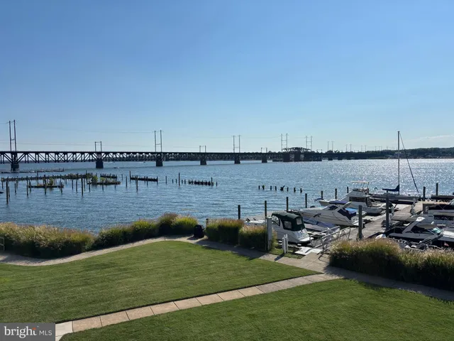 a kitchen with a sink appliances and cabinets