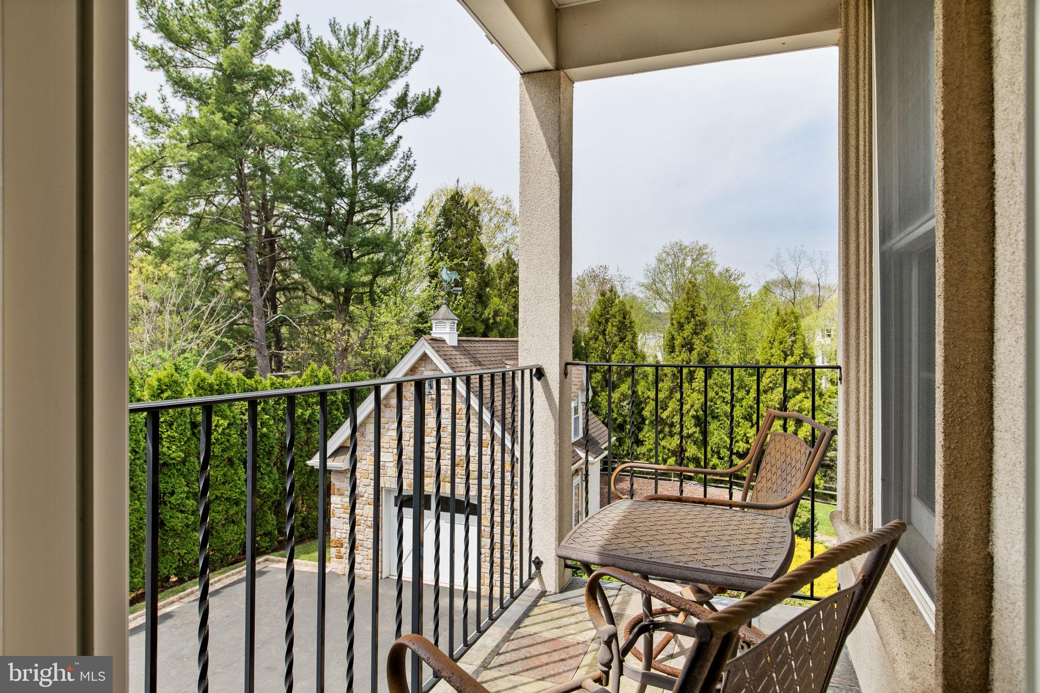 1519 Cedar Hill Road Lower Gwynedd, PA 19002 - Photo 46 of 95 a view of a balcony with chair and wooden floor