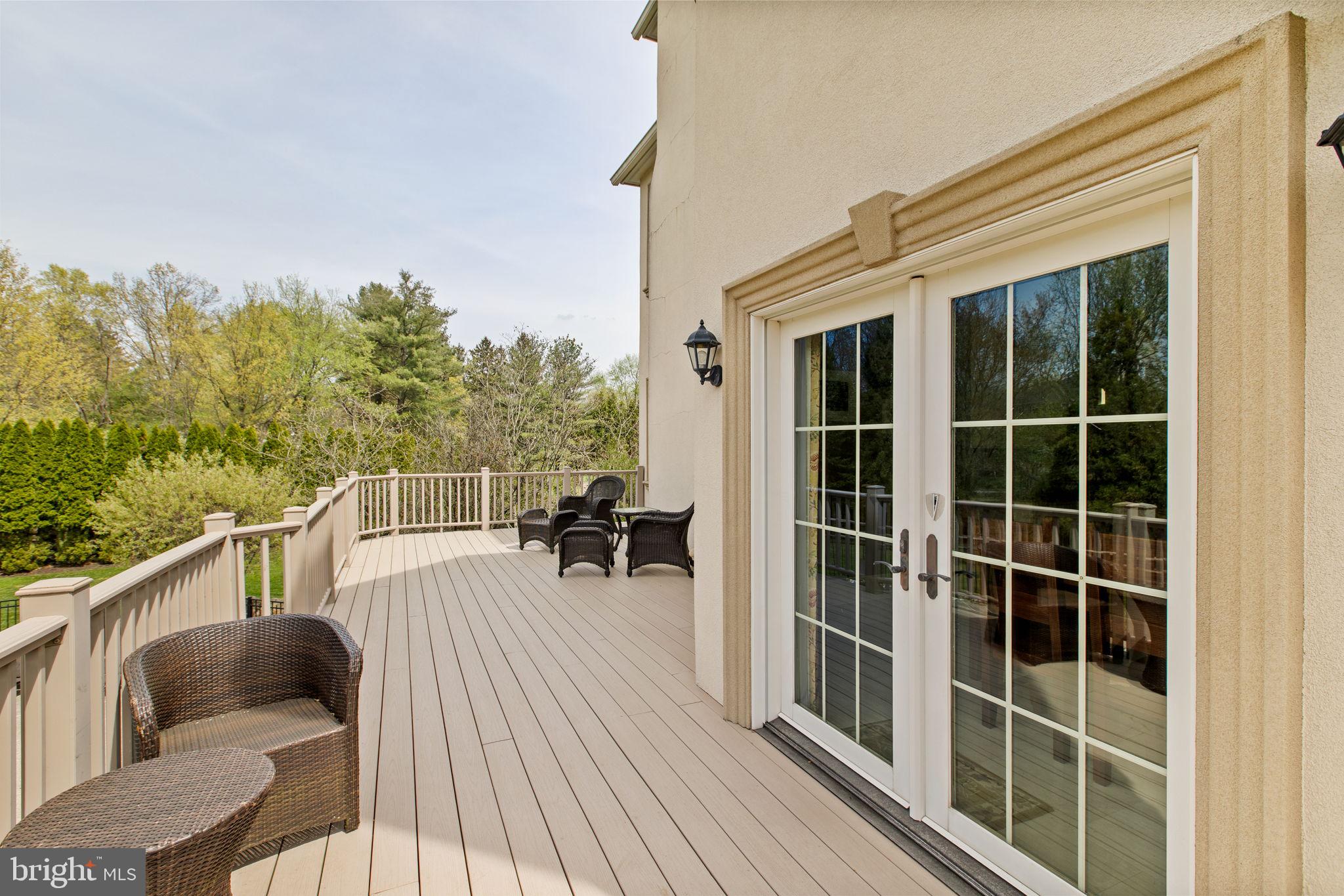 1519 Cedar Hill Road Lower Gwynedd, PA 19002 - Photo 56 of 95 a balcony with wooden floor and furniture