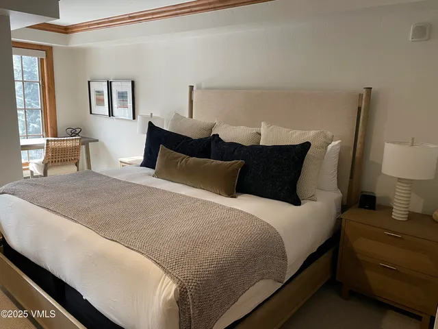 a bedroom with bed and window