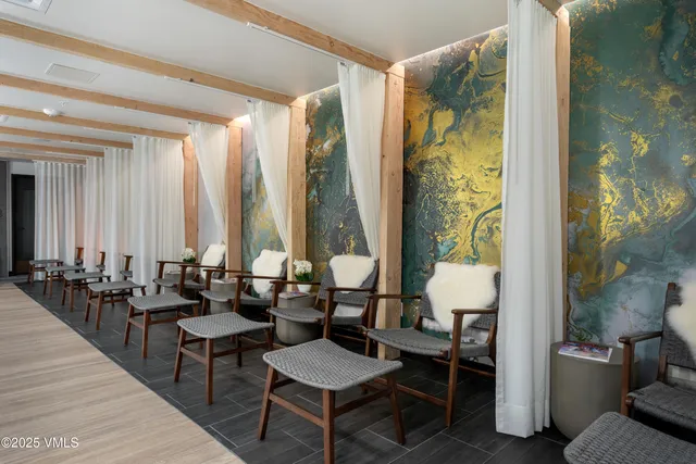 a bathroom with double vanity sinks and a mirror