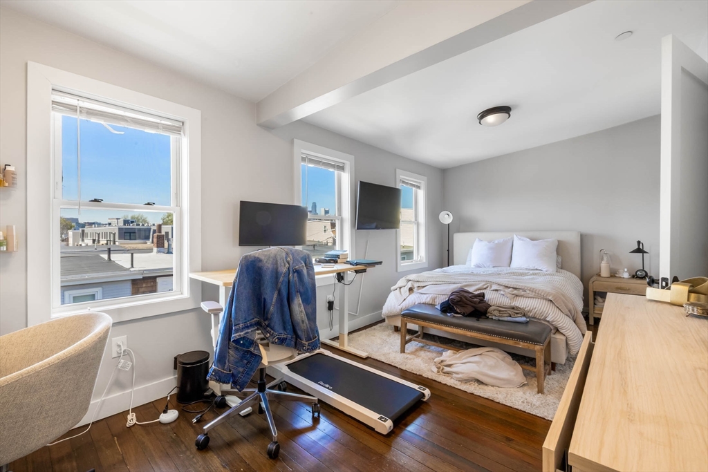 20 Grimes Street, Unit SF Boston, MA 02127 - Photo 11 of 15 a bedroom with furniture and a window
