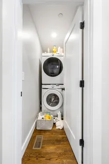 a view of a hallway with washer and dryer