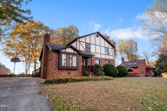 a view of a brick building next to a road