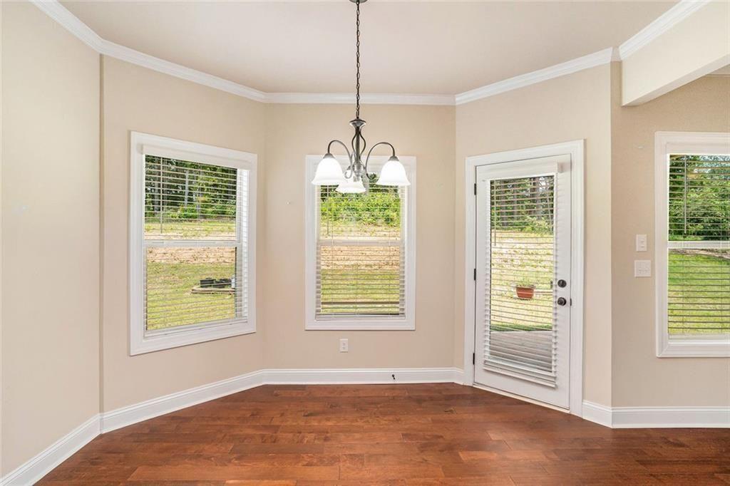 381 Homestead Circle Forsyth, GA 31029 - Photo 11 of 49 a view of an empty room with windows