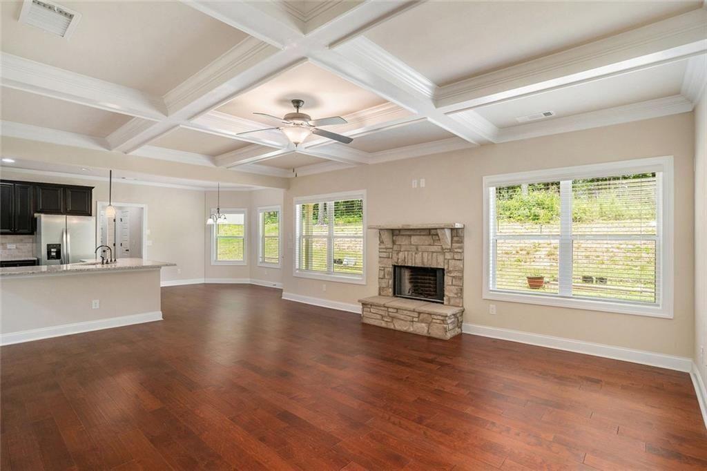 381 Homestead Circle Forsyth, GA 31029 - Photo 13 of 49 a view of an empty room with wooden floor and a window